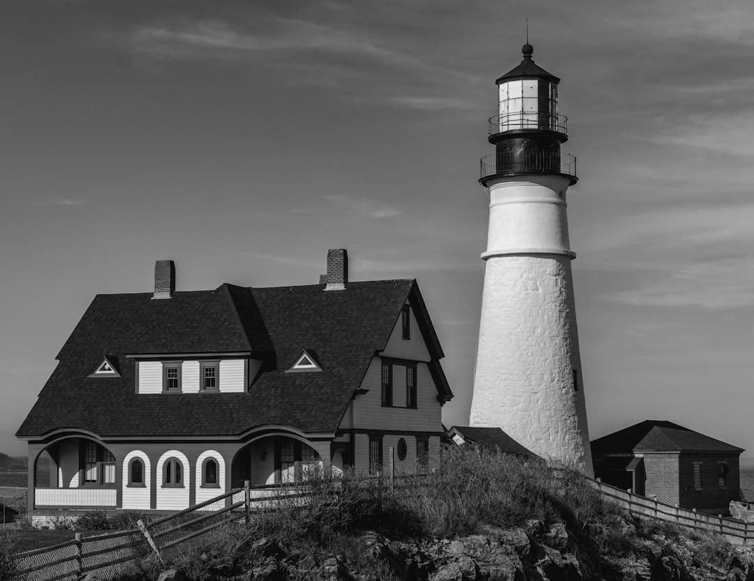 A lighthouse and a house stand tall.