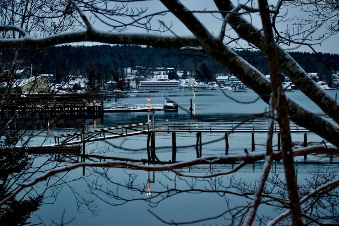 a boat is docked at a pier in the water