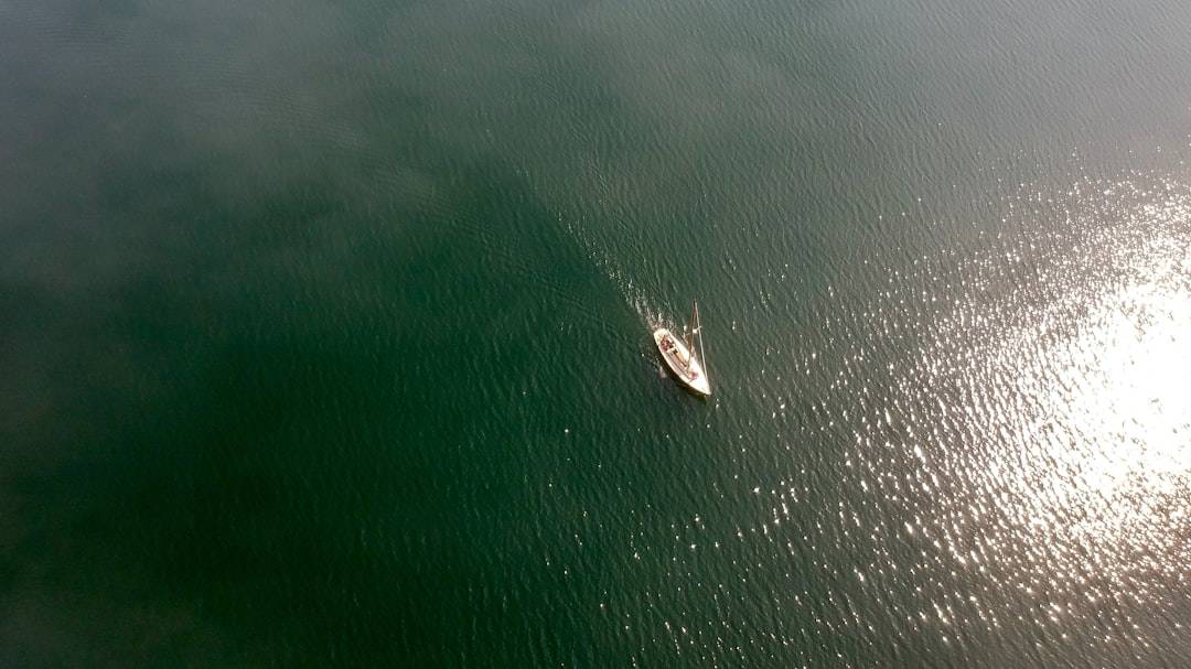 a small boat in a large body of water