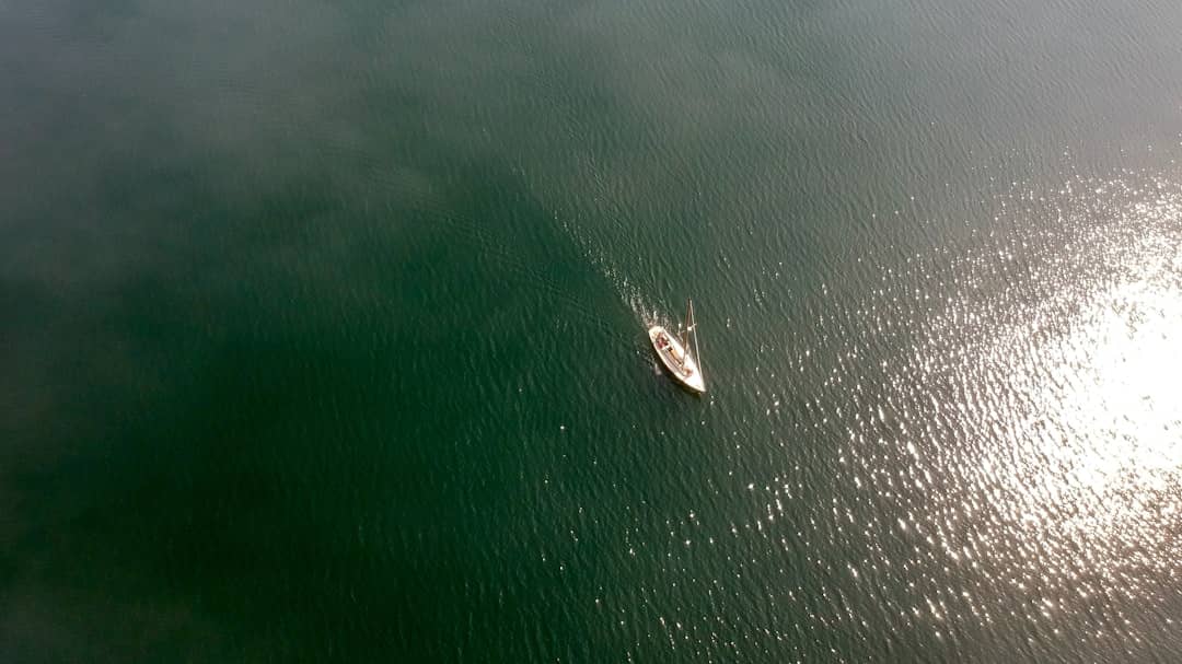 a small boat in a large body of water