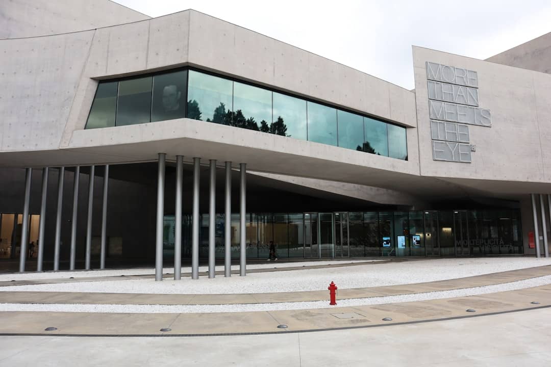 a building with a red fire hydrant in front of it