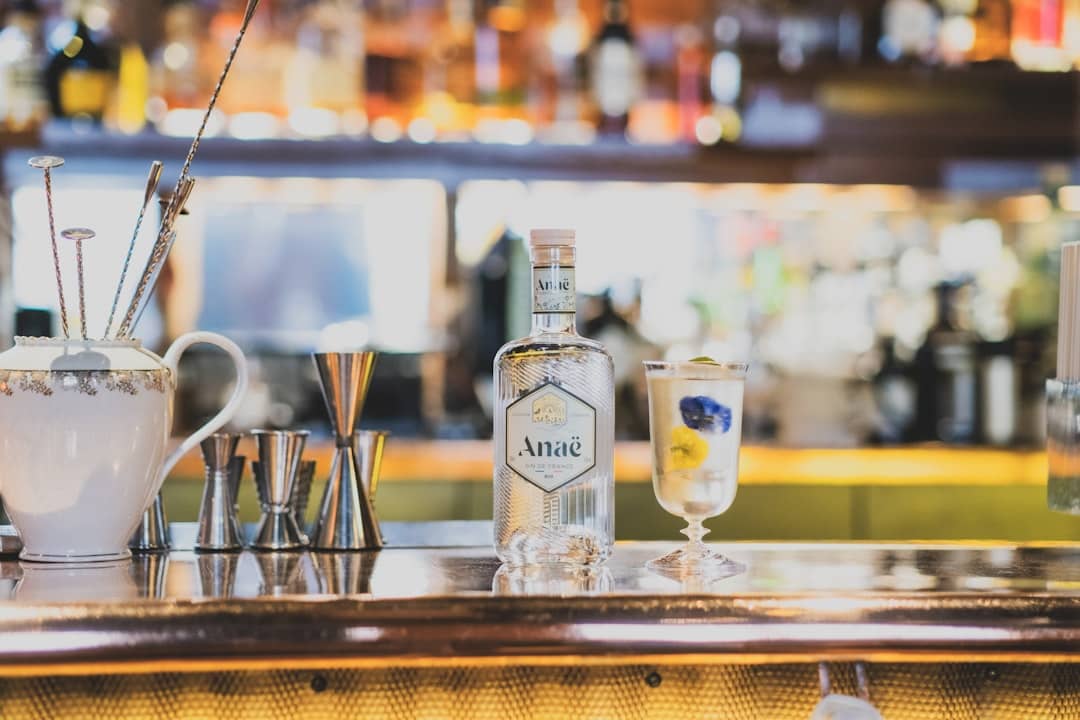 a bar with bottles of alcohol and glasses