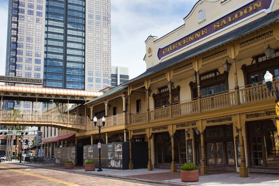 Old western style building next to modern skyscraper.
