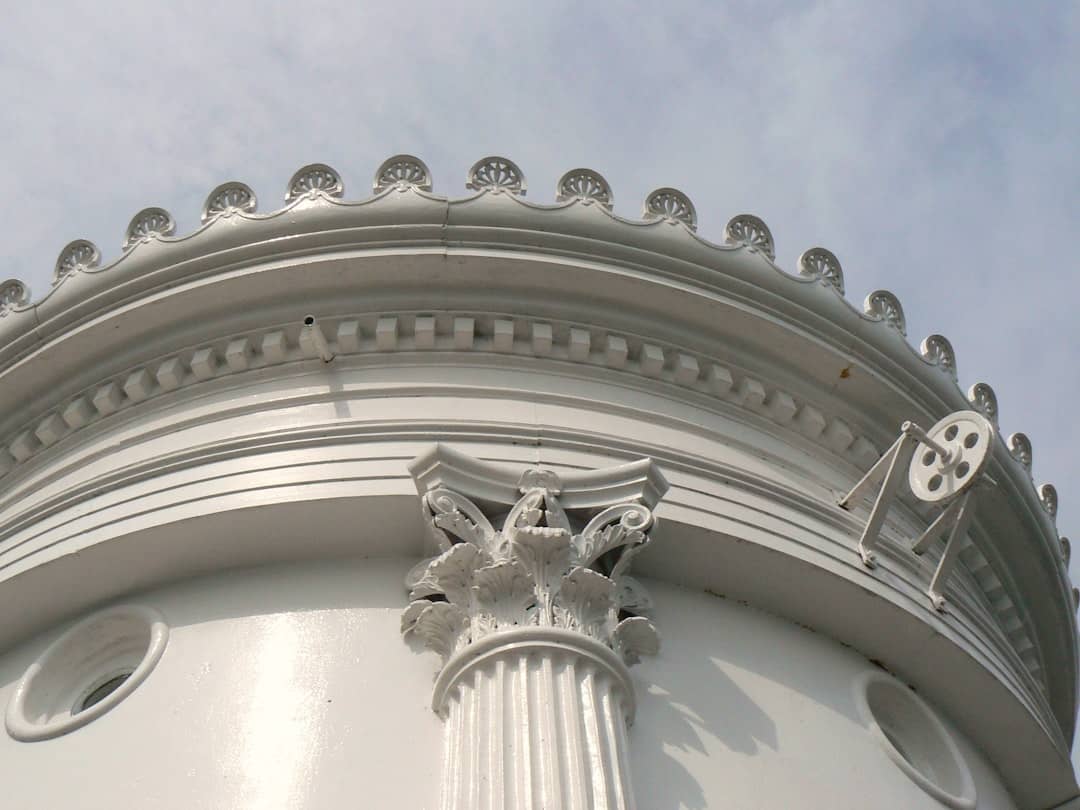 a building with a statue on the top
