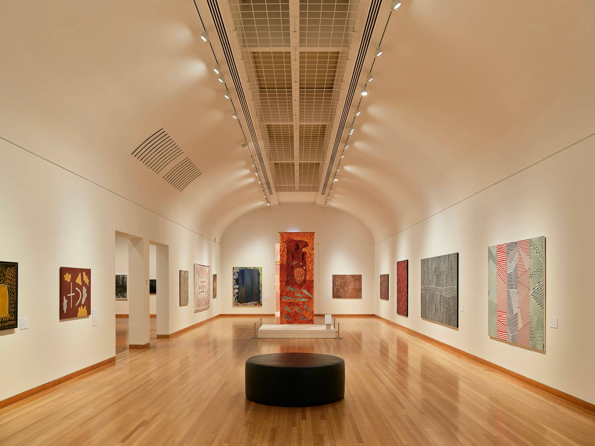 A room with a lot of paintings on the walls