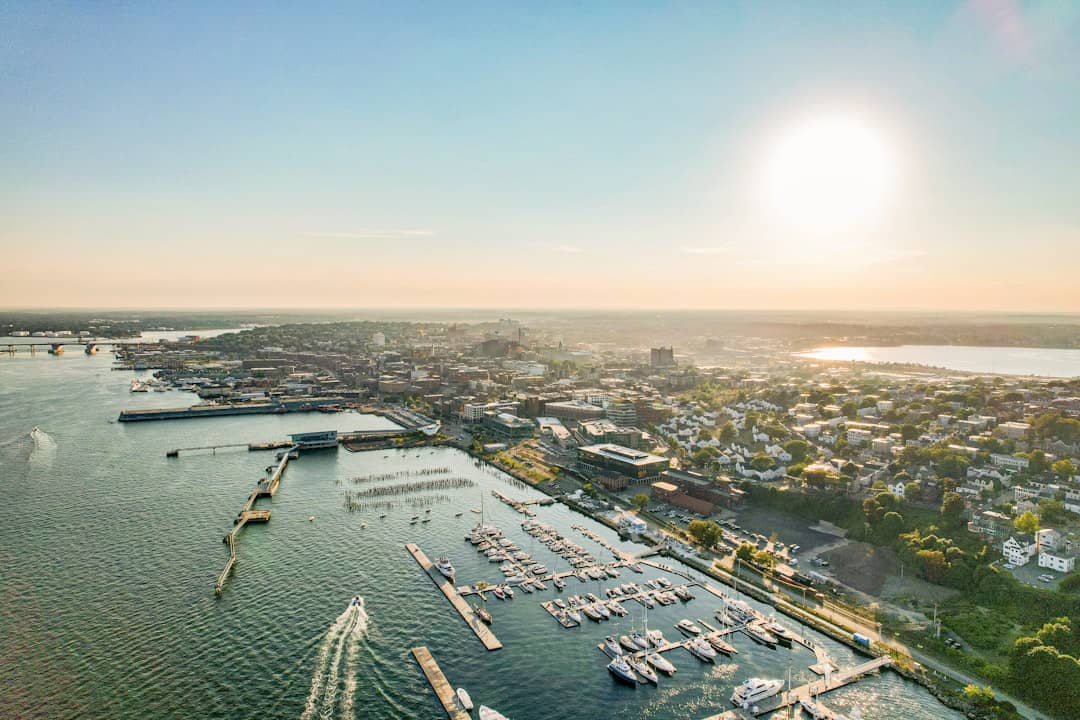 an aerial view of a marina with boats in the water