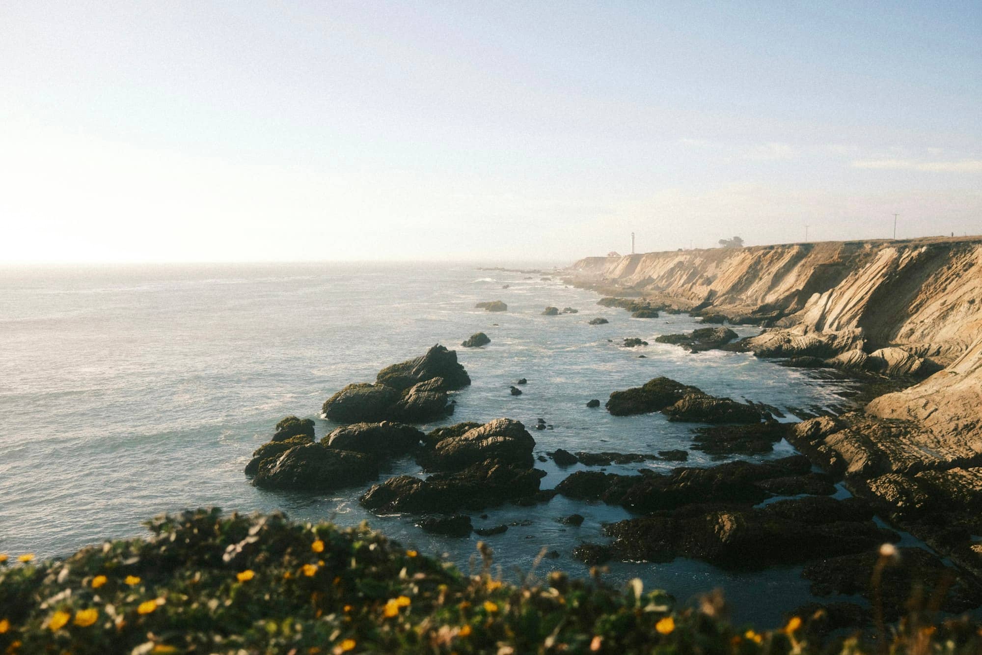 a view of the ocean from a cliff