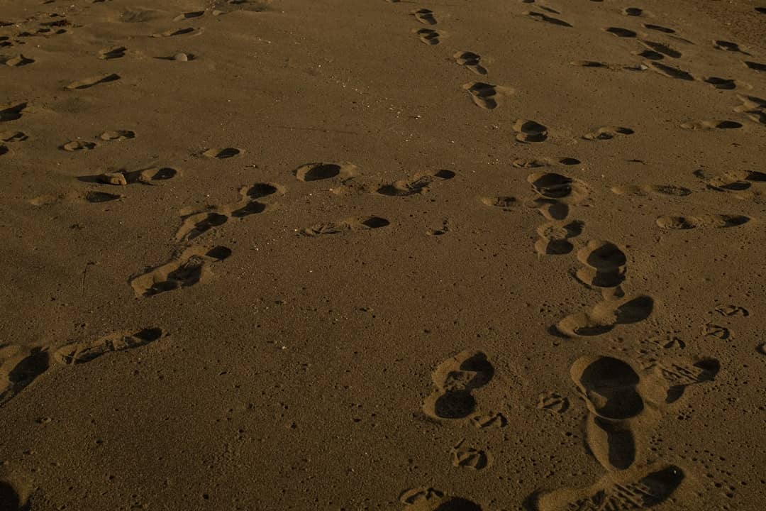 a sandy area with footprints