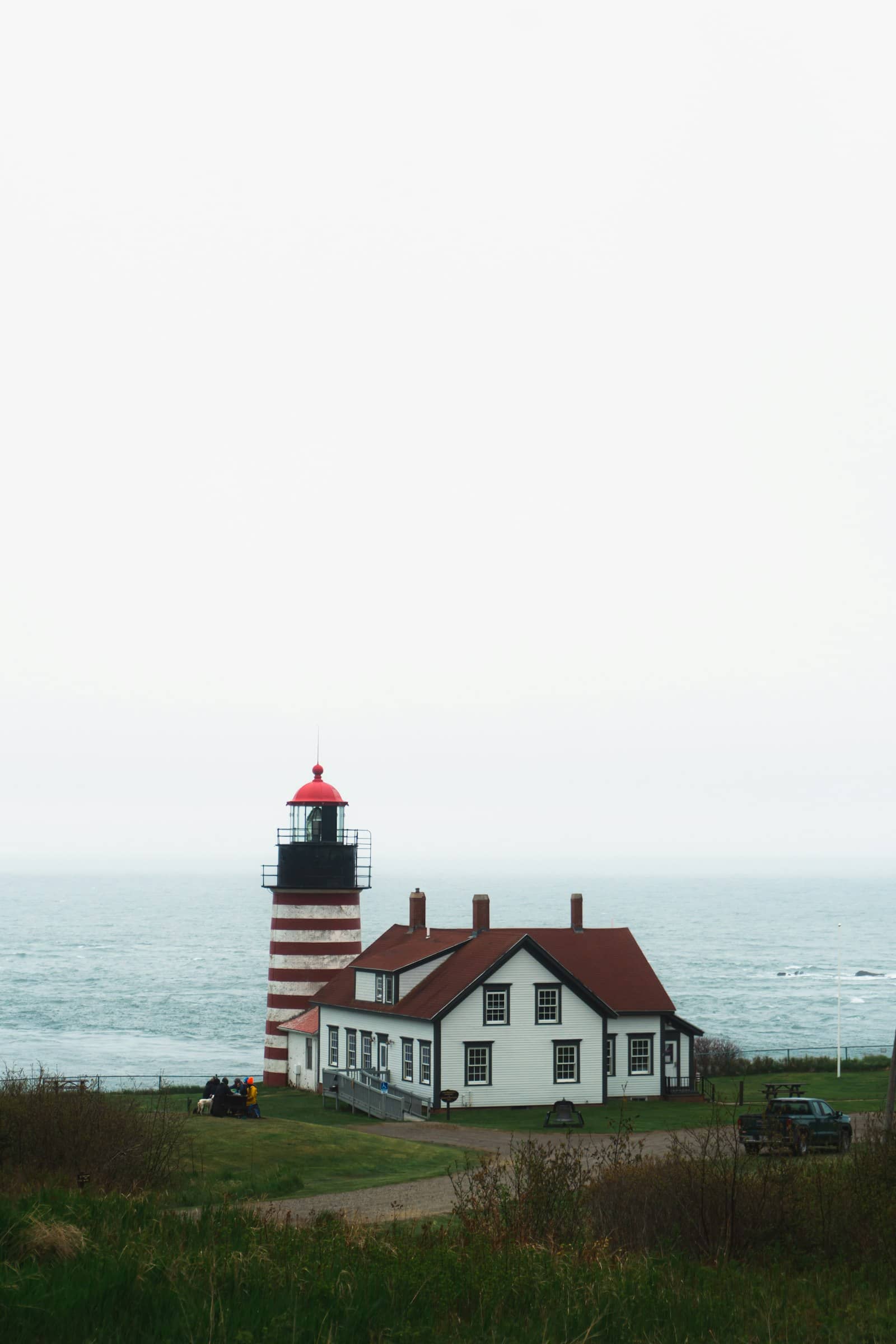 a lighthouse by the water