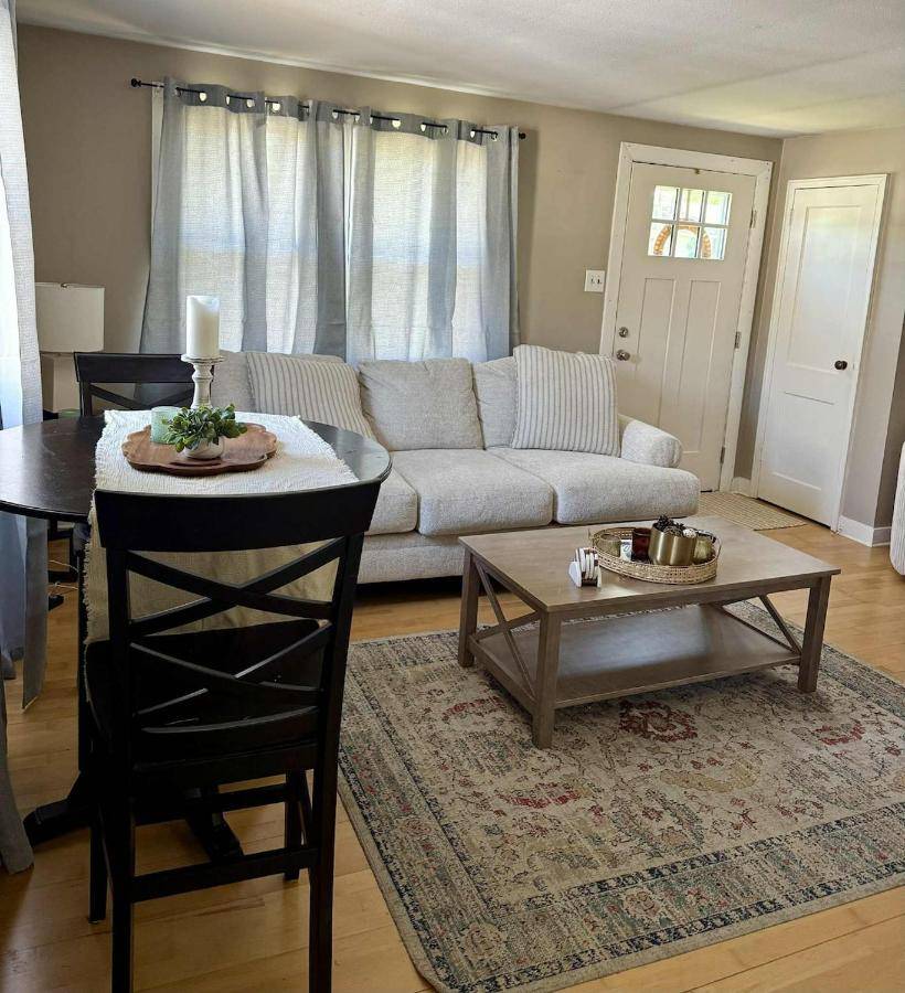 a living room with a couch and a table at Cozy Bangor Home in Bangor