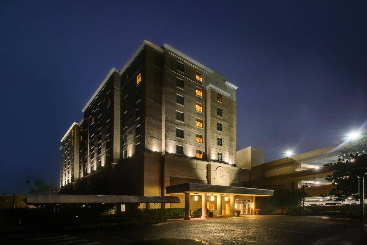 a building at night with a bench in front of it at Hollywood Casino Bangor in Bangor