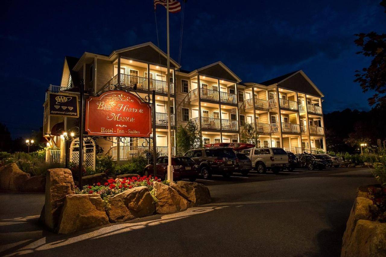 a large building with a sign in front of it at Bar Harbor Manor in Bar Harbor