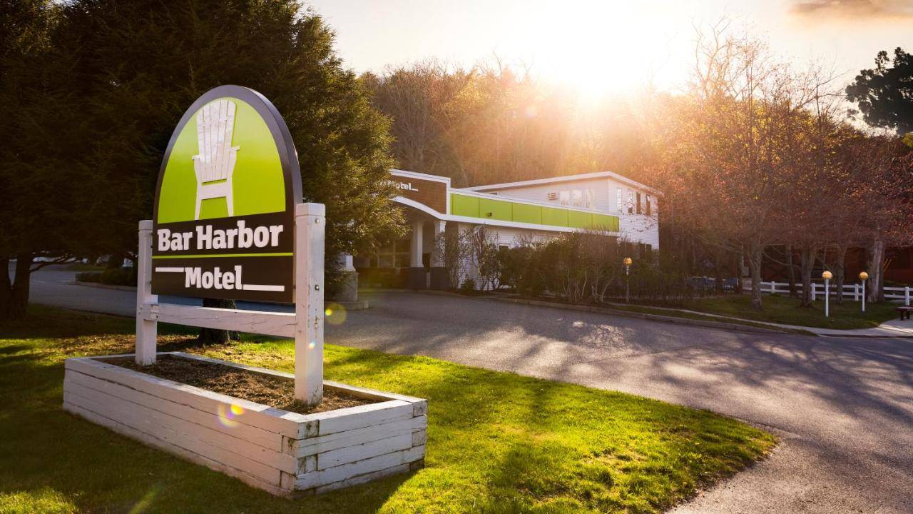 a sign for a hotel in front of a building at Bar Harbor Motel in Bar Harbor