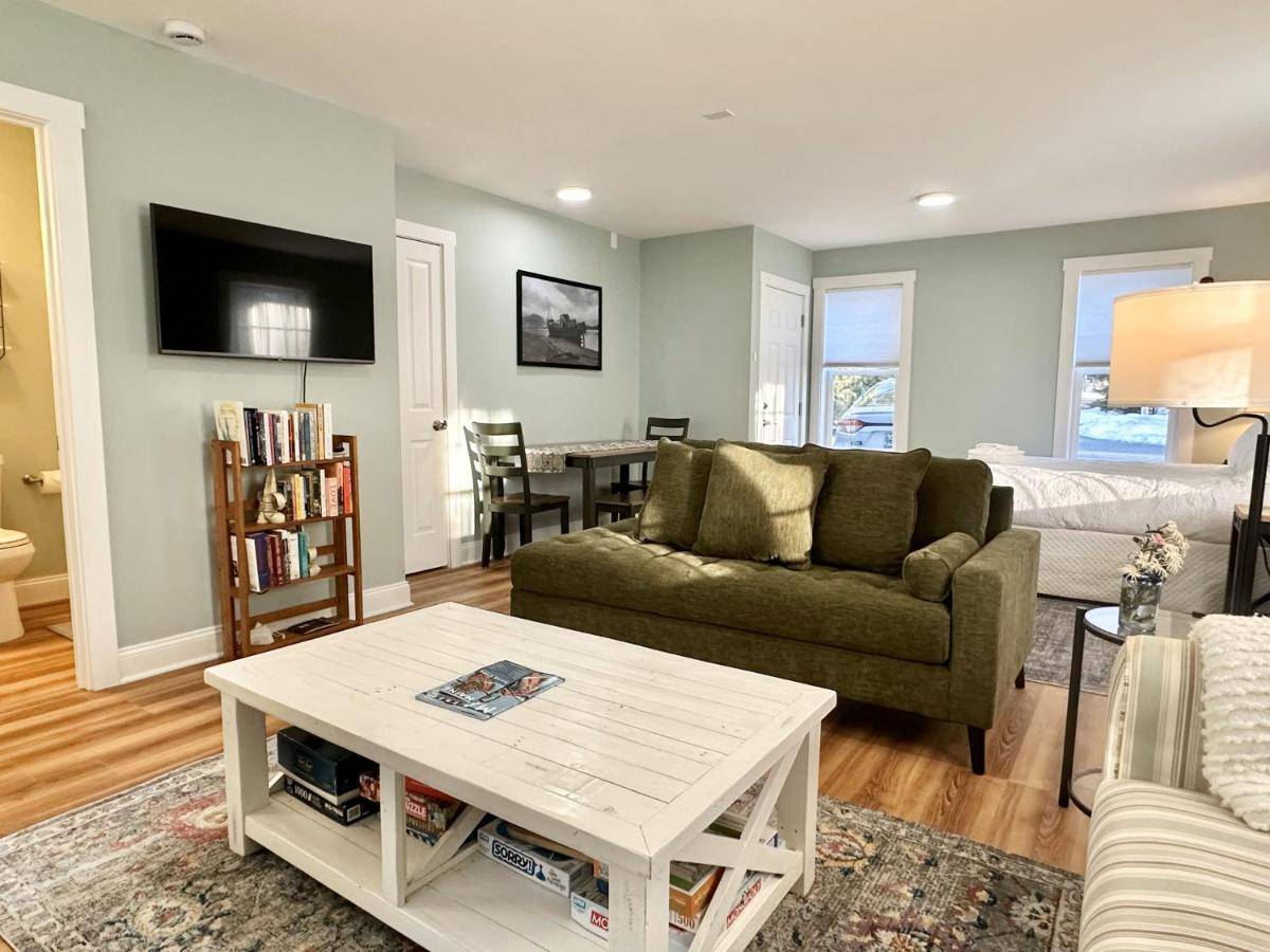 a living room with a couch and a table at 2 BR Home in Bar Harbor Town Hill "Deer Run" in Bar Harbor