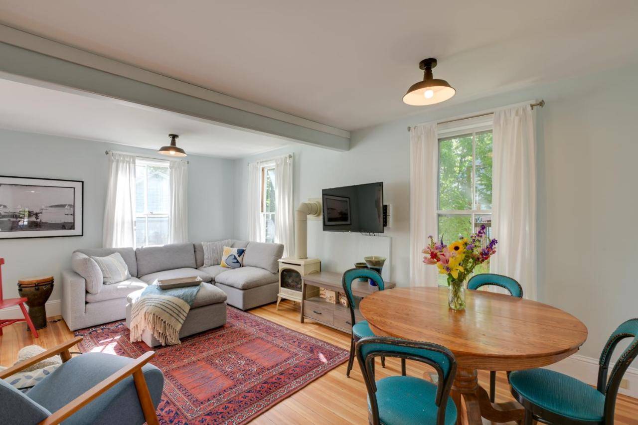 a living room with a couch and a table at Downtown Bar Harbor Rental Home about 1 Mi to Acadia! in Bar Harbor