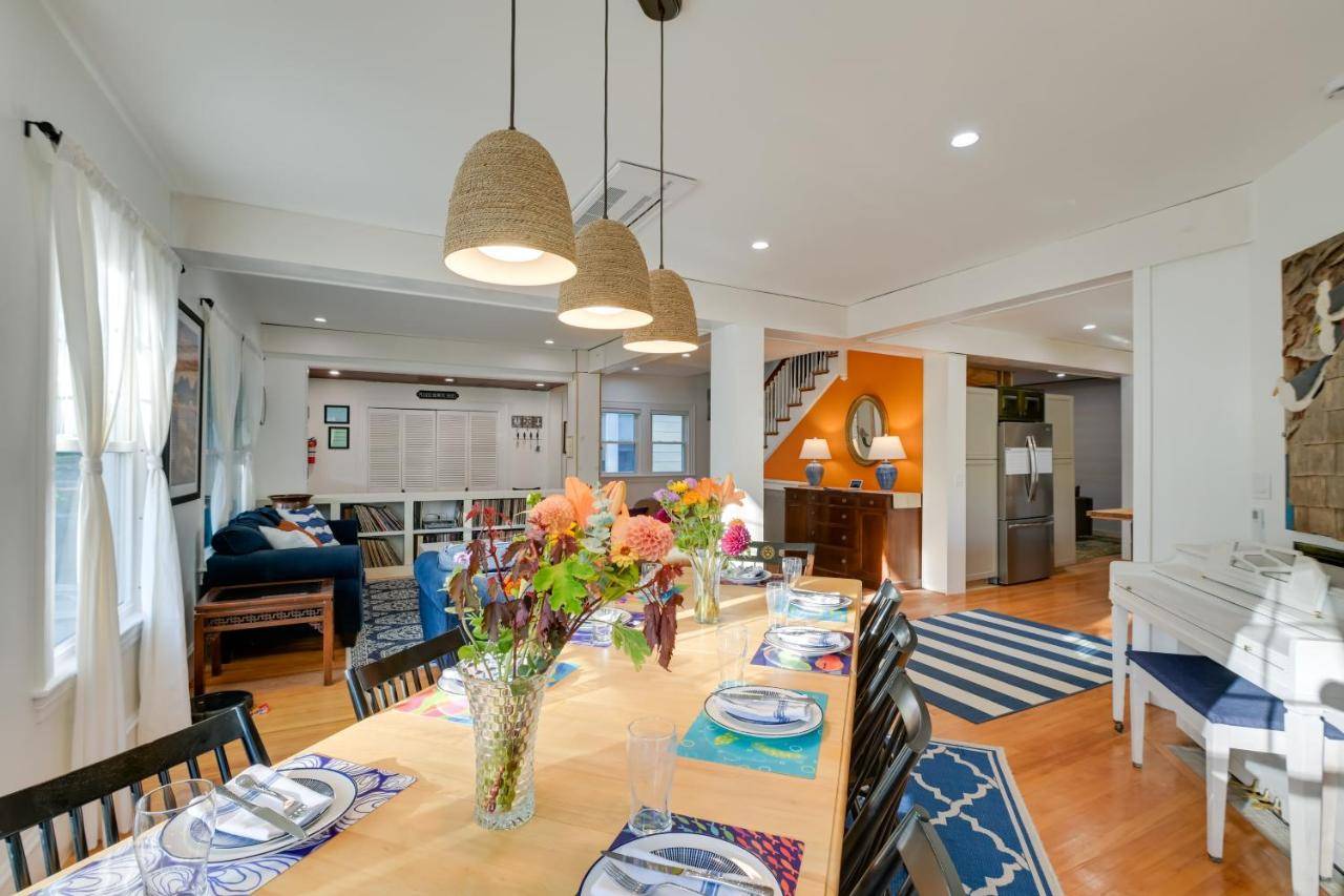 a dining room and living room with a table and chairs at Historic Bar Harbor Home about 2 Blocks to Main St! in Bar Harbor