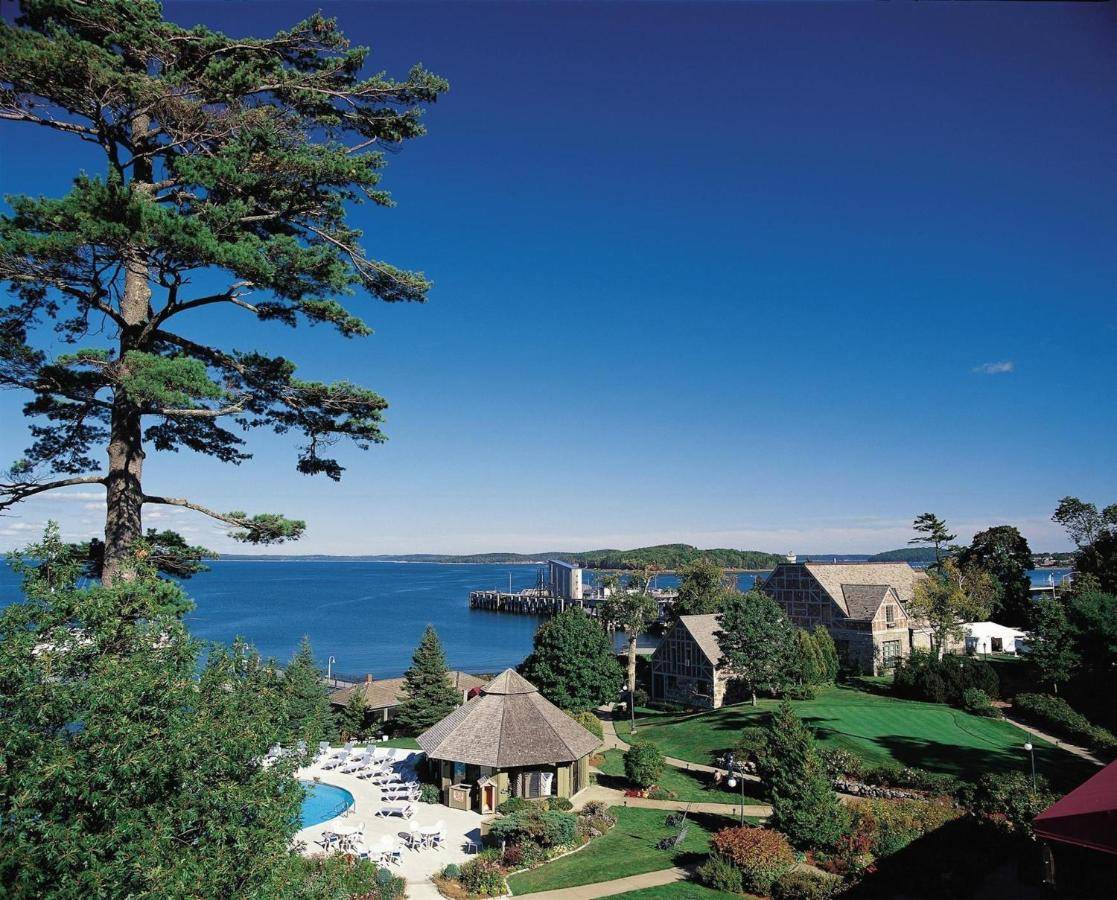 an aerial view of a resort with a pool and trees at Holiday Inn Bar Harbor Regency Hotel by IHG in Bar Harbor