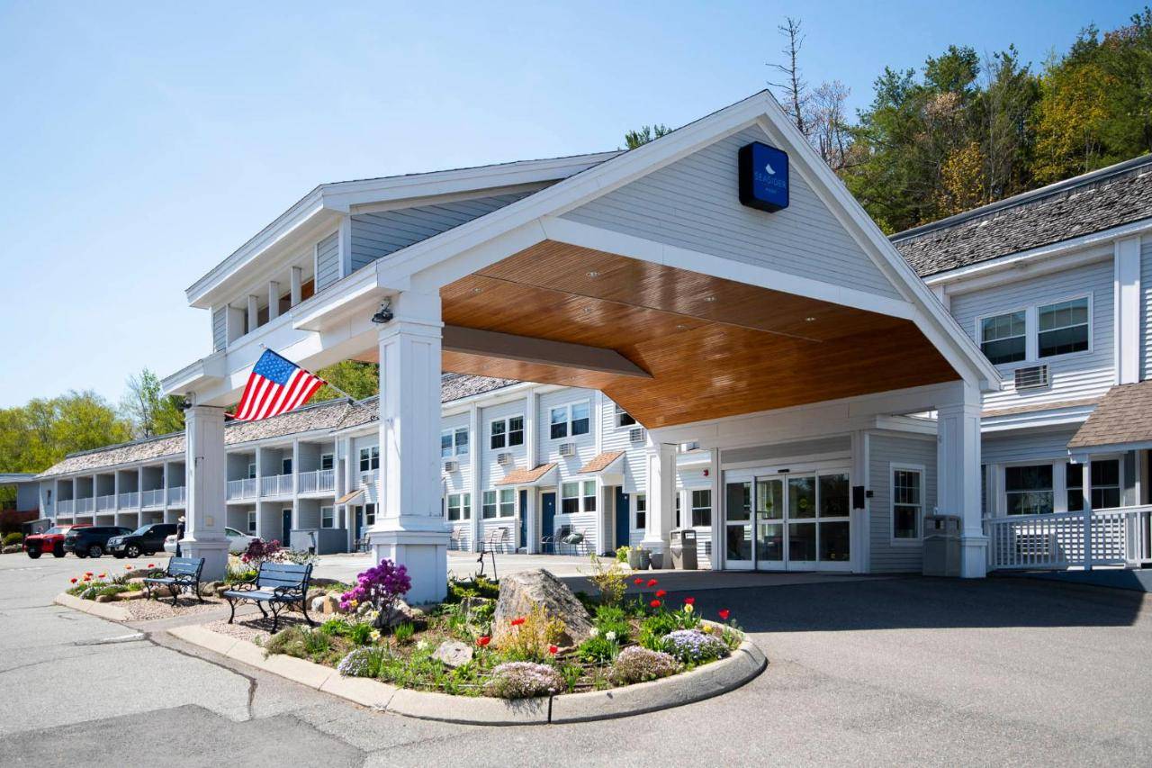 a large building with an american flag on the front at Seasider Motel in Bar Harbor