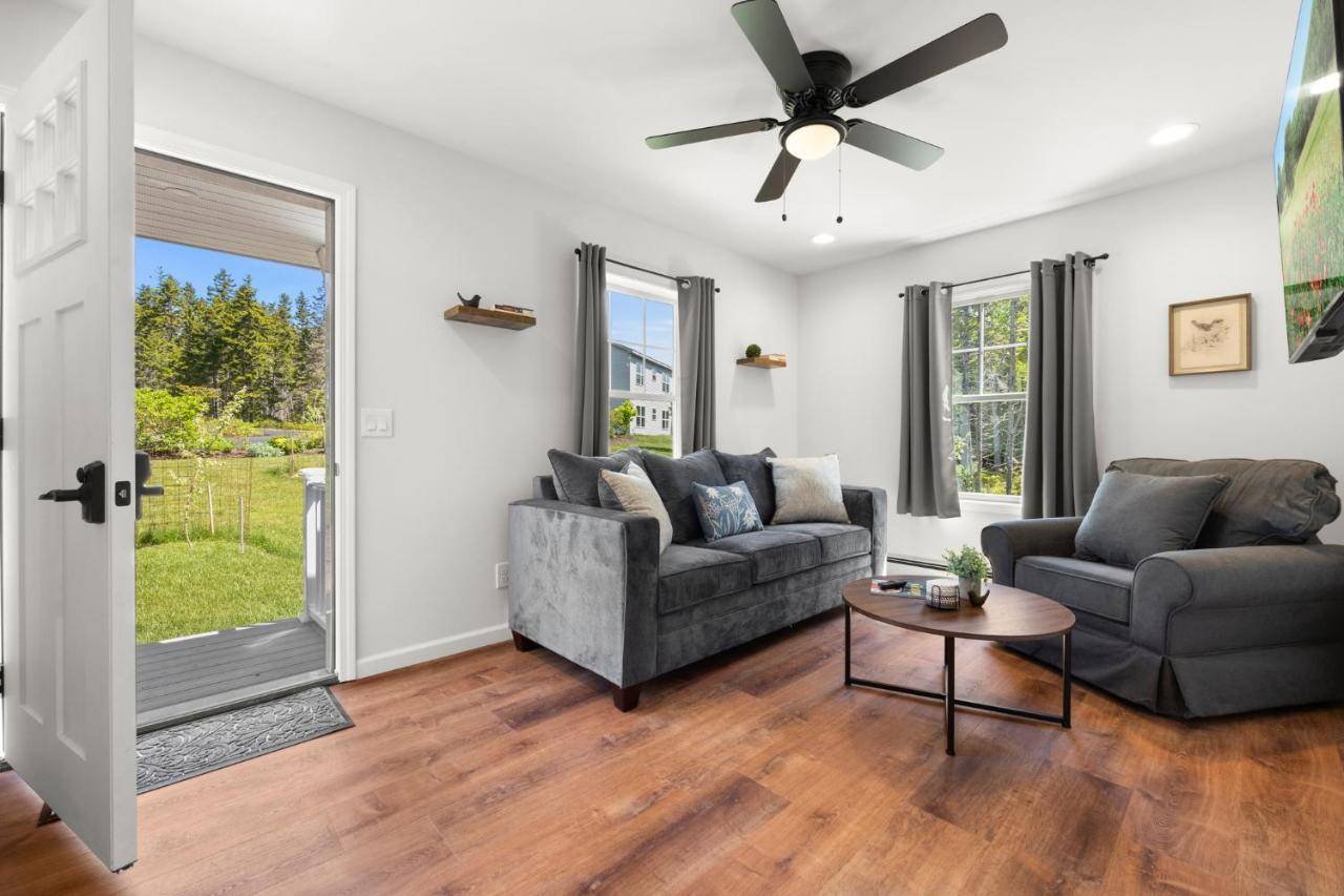 a living room with two couches and a table at Huckleberry Lane Retreat in Bernard