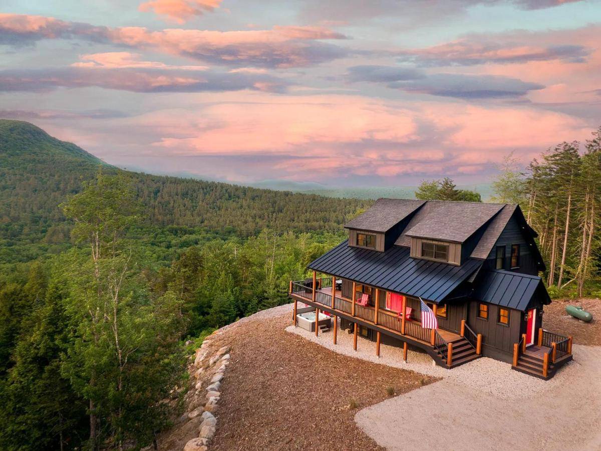 a house sitting on top of a hill at Best View Sunday River! Brand New Luxurious Chalet in Bethel
