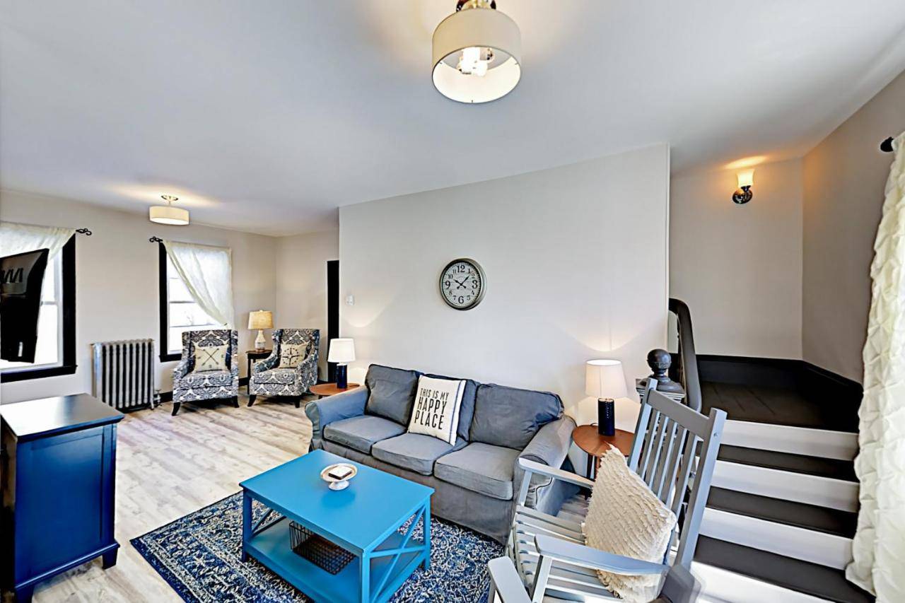 a living room with a couch and a table at Boothbay Haven in Boothbay Harbor