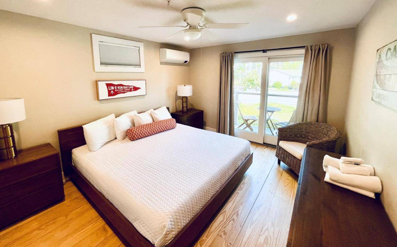 a hotel room with a bed and a window at Linekin Bay Resort in Boothbay Harbor