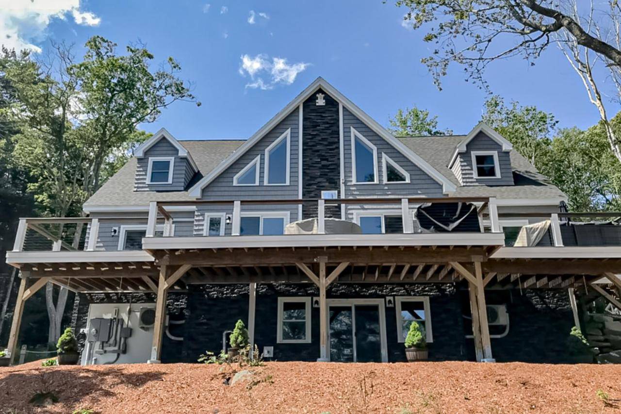 a house with a wrap around porch at Lobster Shack in Boothbay