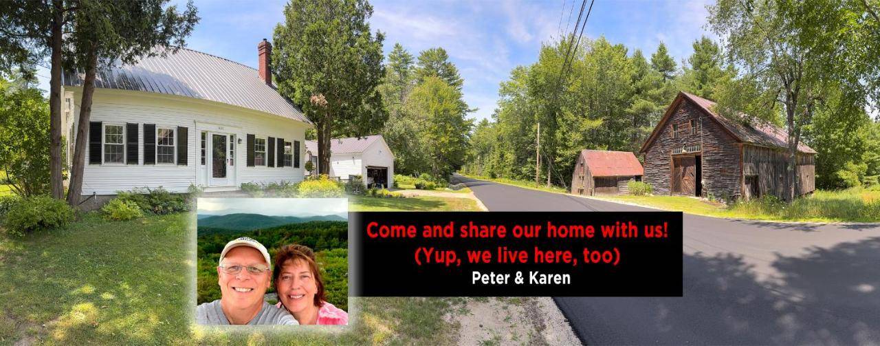 a picture of a house with a sign in front of it at Dancing Light Farm in Bridgton