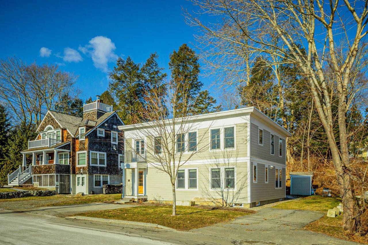a large white house with a black at Harborwalk Lower and Upper in Camden