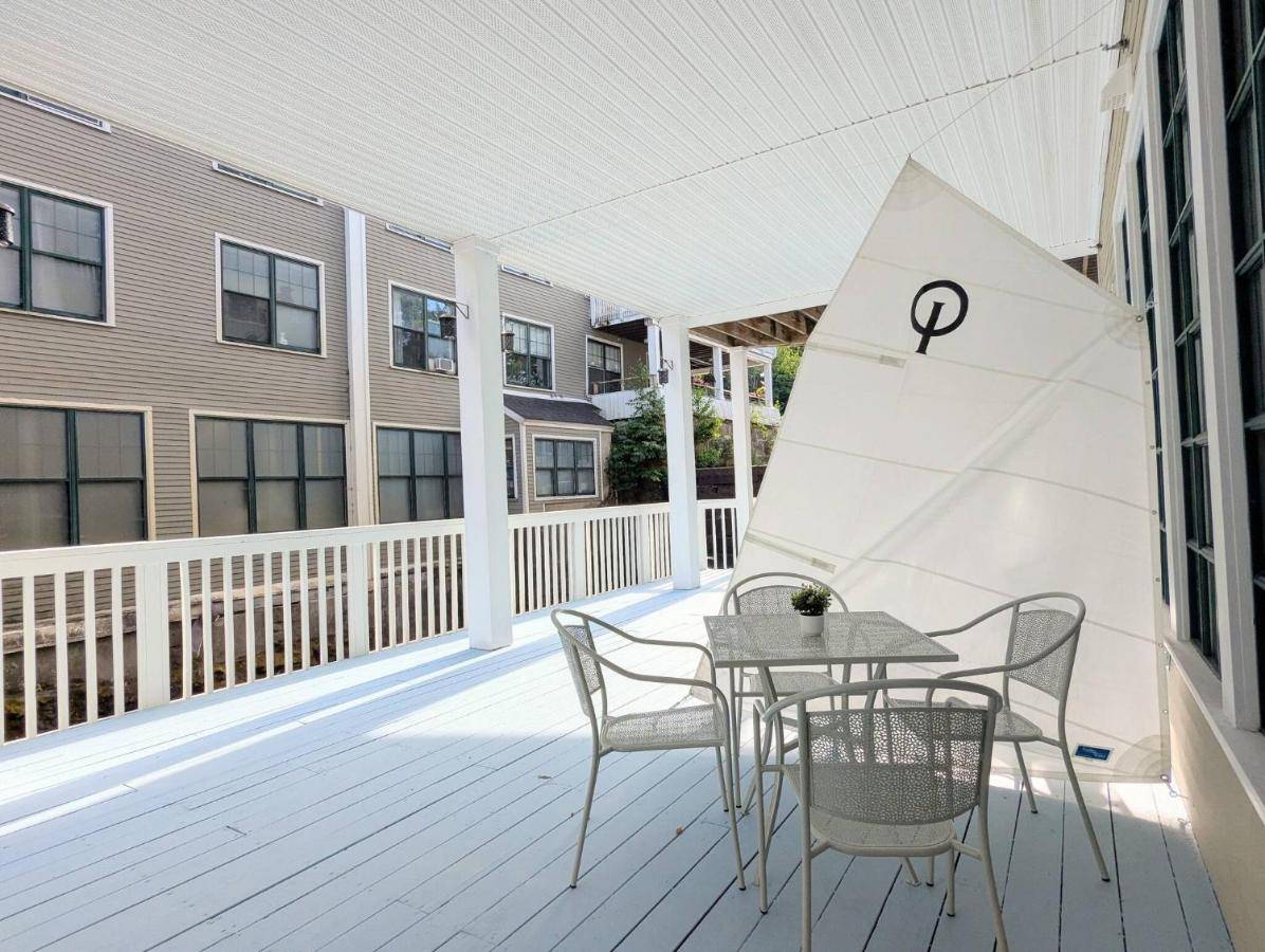 a patio with a table and chairs on a building at The Optimist Guesthouse | 4 in Camden