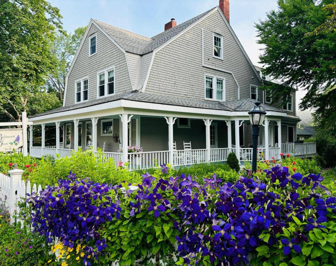 a house with purple flowers in the yard at The Belmont Inn in Camden