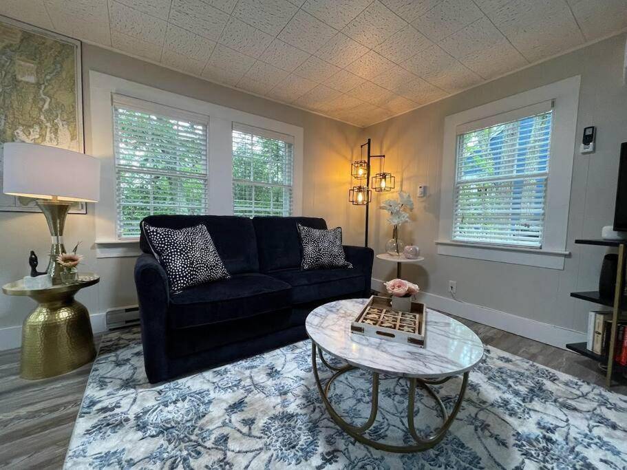 a living room with a couch and a table at Spacious 1 Bedroom Close to Everything 4 in Edgecomb