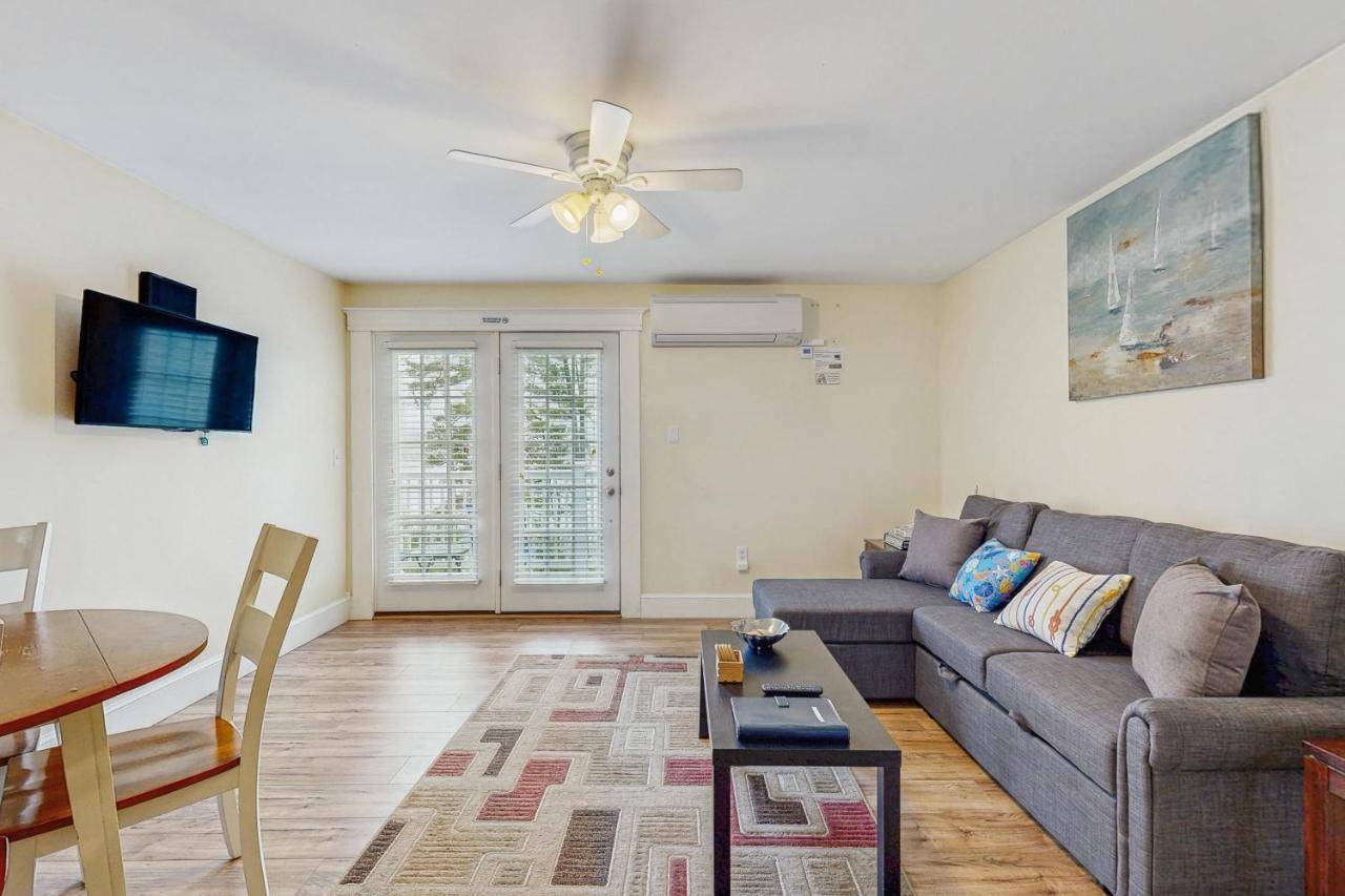 a living room with a couch and a table at The View II at Sheepscot River in Edgecomb