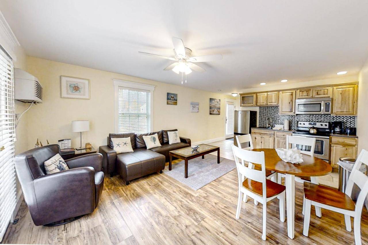 a living room with a couch and a table at The View IV at Sheepscot River in Edgecomb