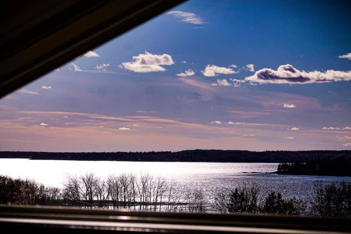 a view of a lake from a train window at Bayside Waterview Cottage in Ellsworth