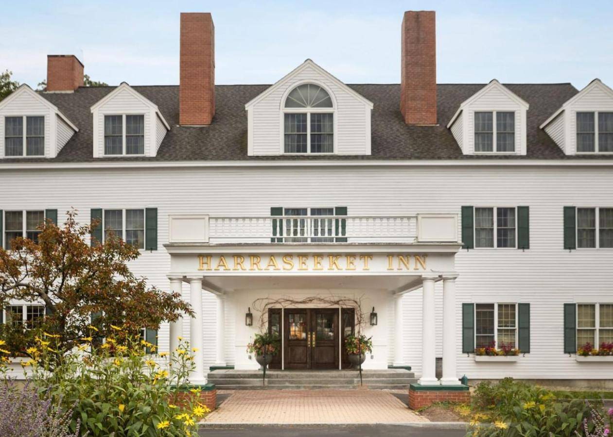 a white building with a sign that reads harvard inn at The Harraseeket Inn & Event House Freeport Downtown in Freeport