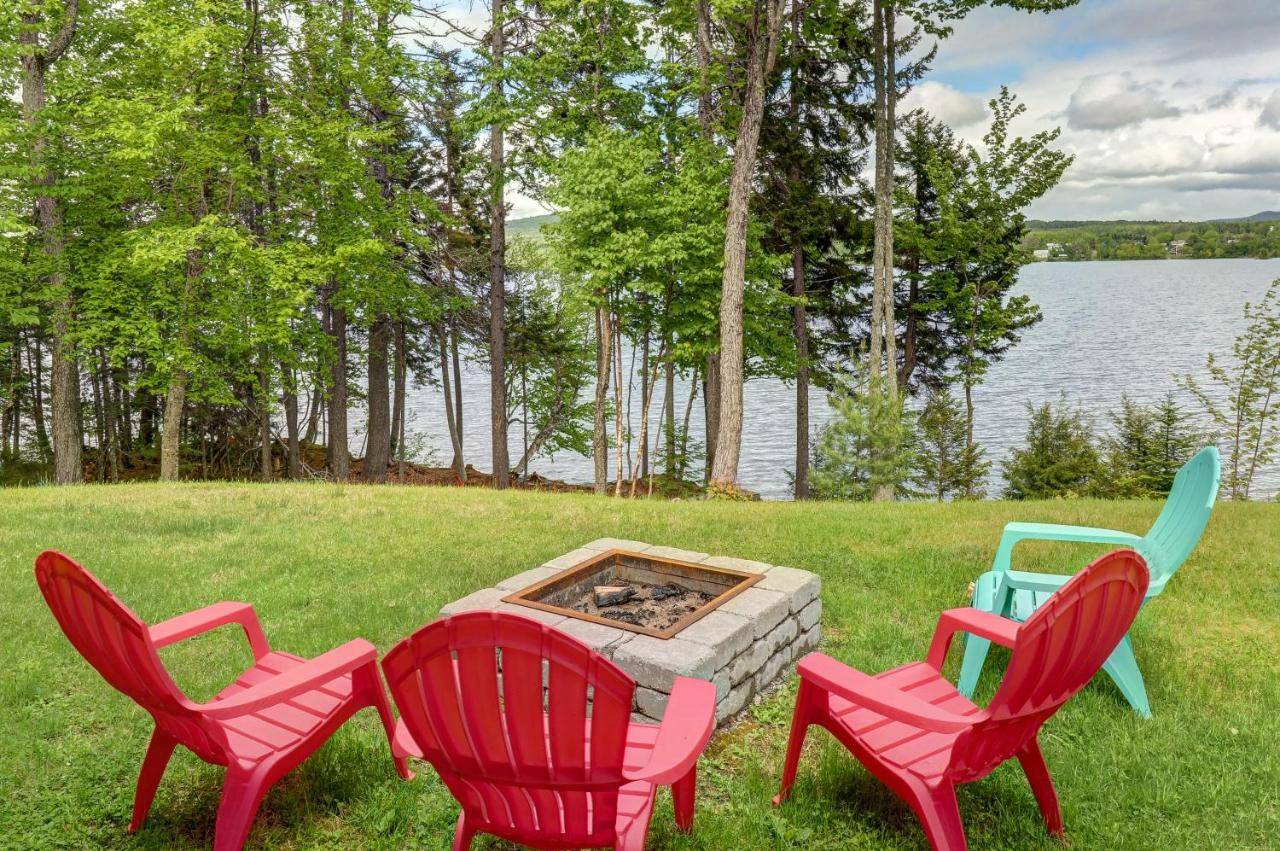 a group of four chairs around a fire pit at Lakeside Chalet in Greenville
