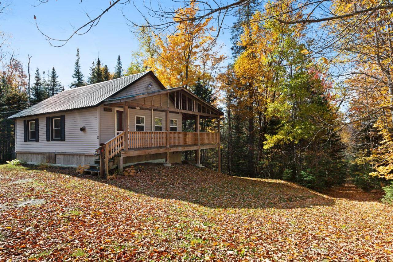 a small house in the woods with leaves on the ground at Lily's Pad in Greenville