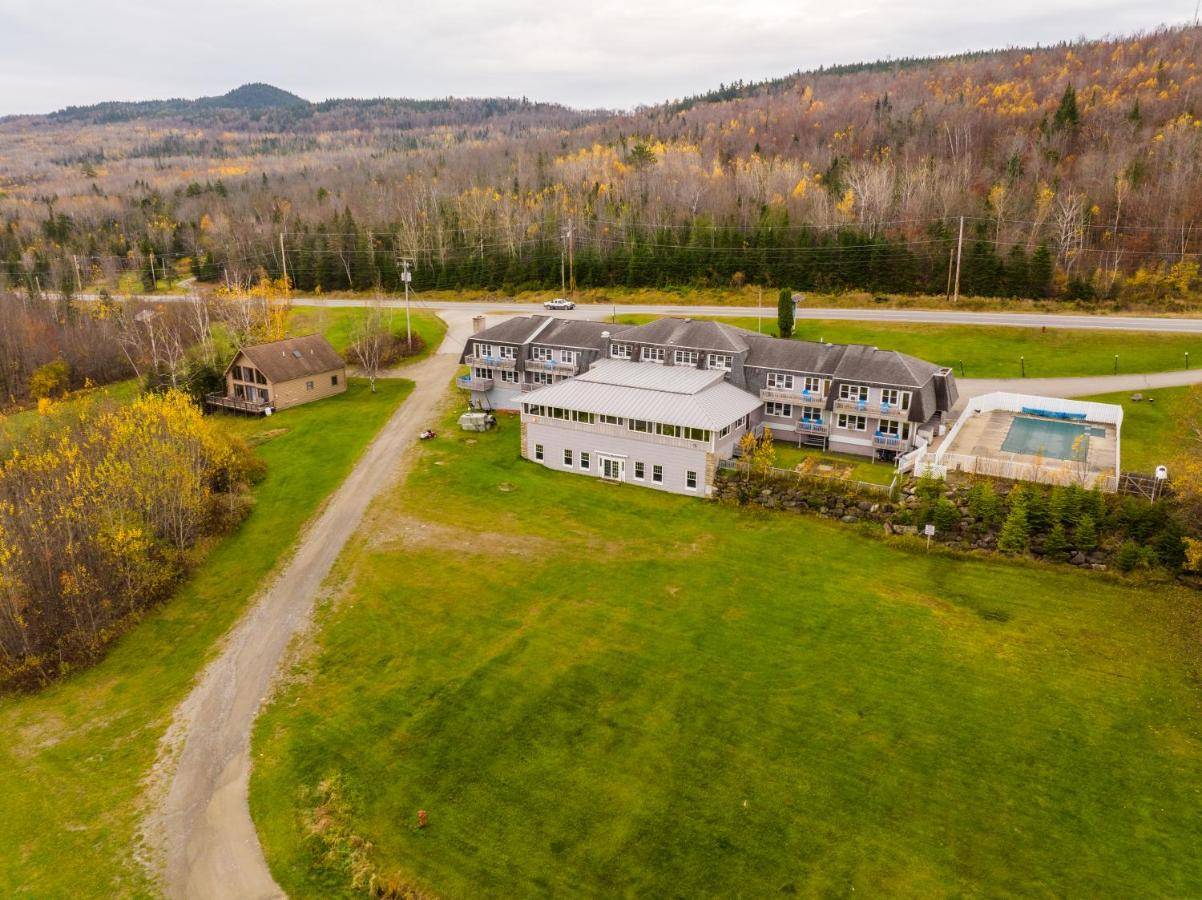 an aerial view of a large house in a field at Mountainview Resort by Coolvacay in Jackman