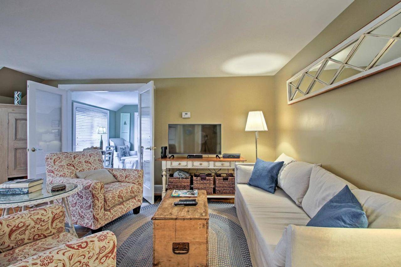 a living room with a couch and a table at half Mi to Beach Lovely Guesthouse in Kennebunk! in Kennebunk