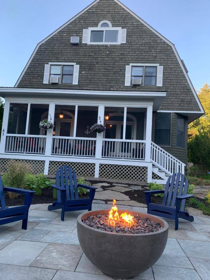 a fire pit in front of a house at White Sails Inn in Kennebunk