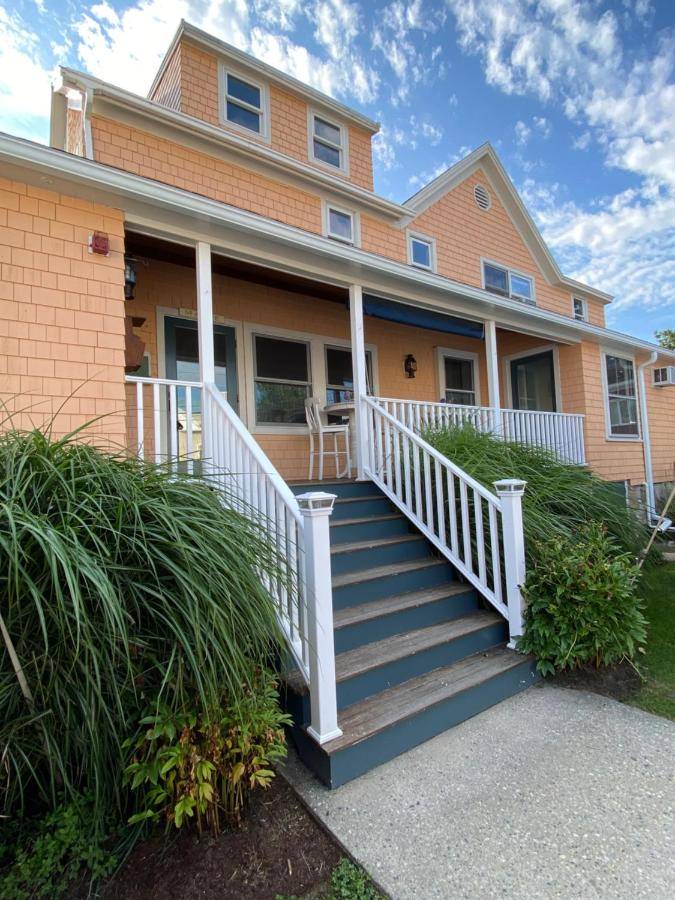 a house with a white staircase in front of it at Mabel's House in Kennebunkport