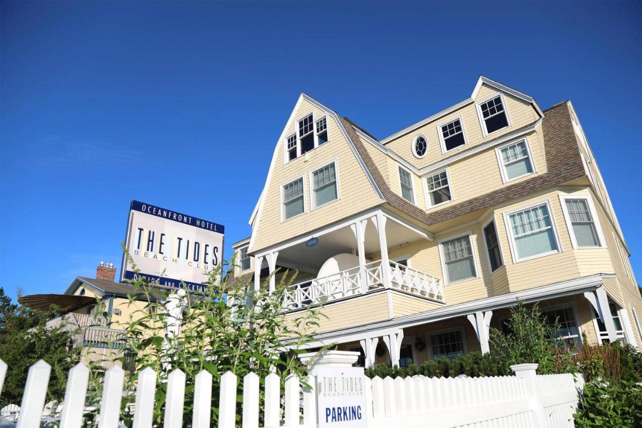 a large house with a white picket fence at The Tides Beach Club in Kennebunkport
