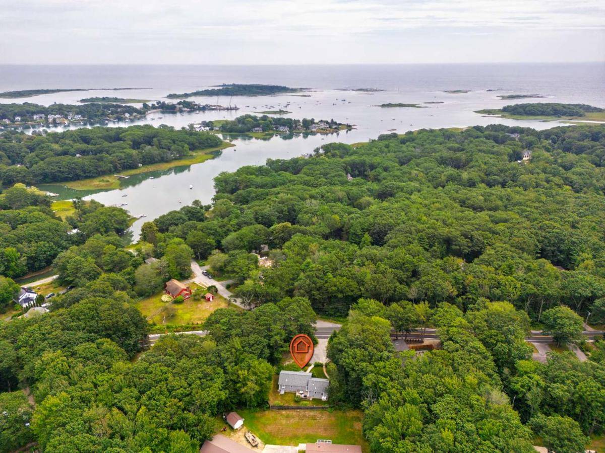 an aerial view of a river and trees at Tranquil Tides Home for 8 in Kennebunkport