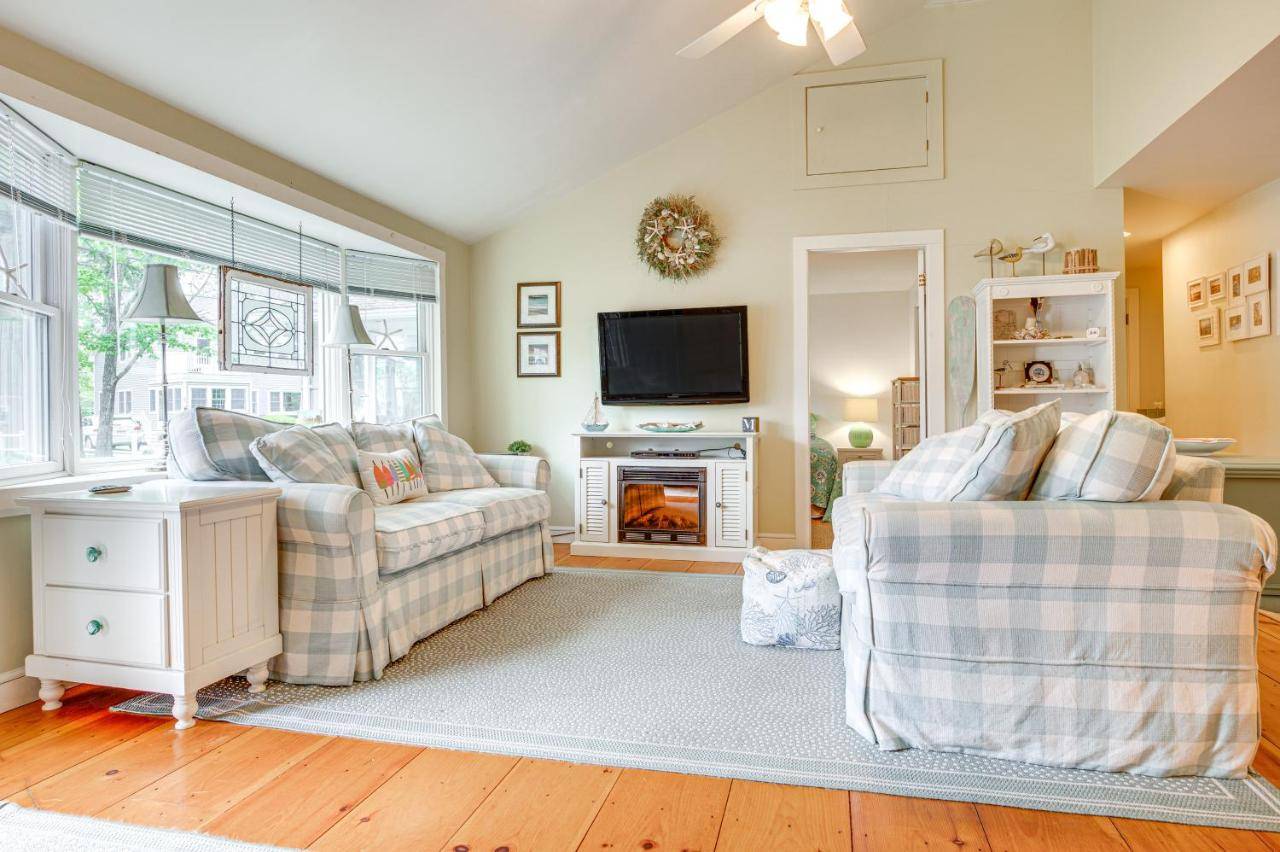a living room with two couches and a tv at Walk to Goose Rocks Beach Quiet Townhome with Patio in Kennebunkport