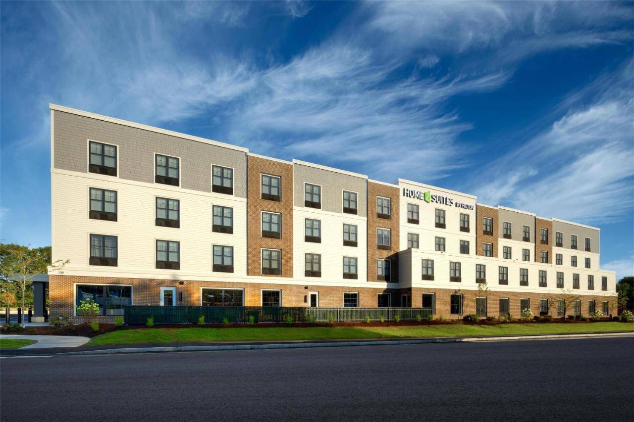 a large white building on the side of a street at Home2 Suites By Hilton Kittery in Kittery