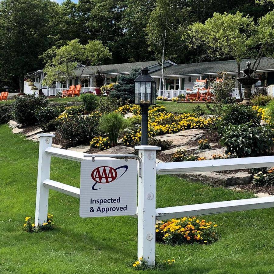 a white fence with a sign on it with aokedoked and approved sign at Charming Retreat for a Romantic Getaway near Penobscot Bay, Maine in Lincolnville