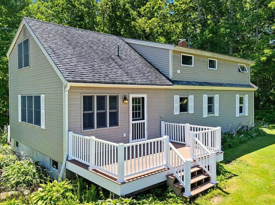 a small house with a porch and a deck at Midcoast Maine Escape- Camden Hills, Lake, Trails in Lincolnville