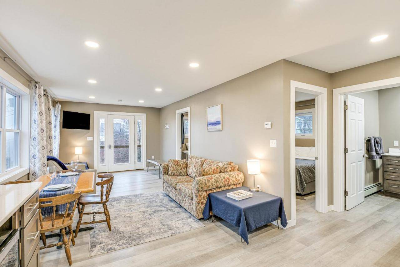 a living room with a couch and a table at Newly Renovated Maine Retreat Deck with Ocean View! in Lubec