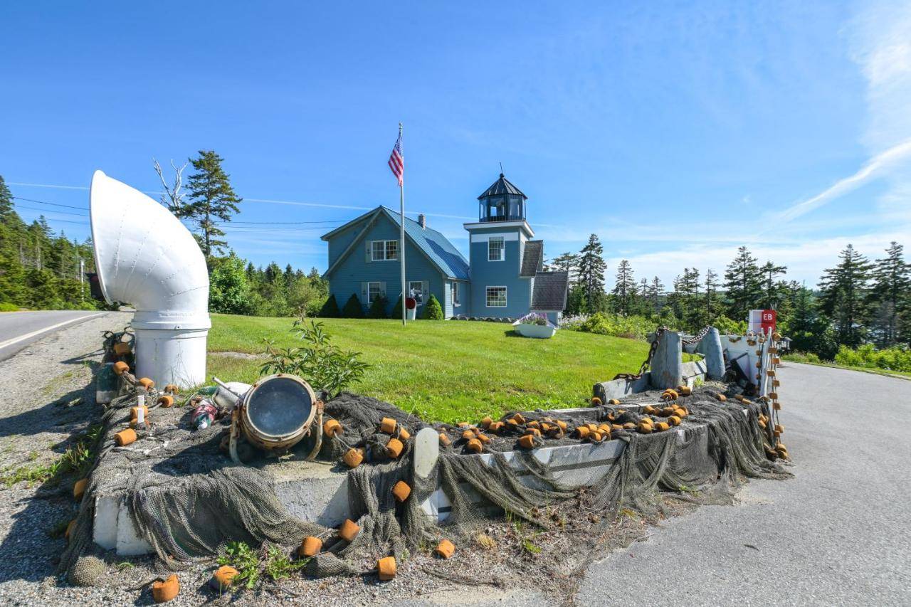 a pile of pumpkins on the side of a road at 4 Mi to Acadia Trails Coastal Maine Home with Deck in Bernard